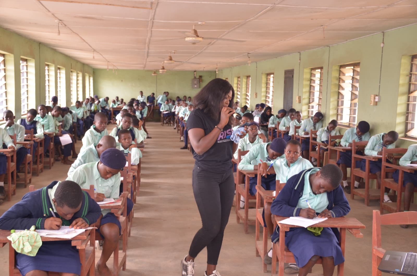 Students seated as a facilitator leads a session at Aatan Baptist Comprehensive High School, 2019.