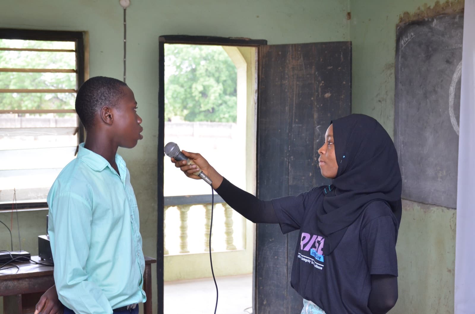 A facilitator presenting at the front of the class, Aatan Baptist Comprehensive High School, 2019.